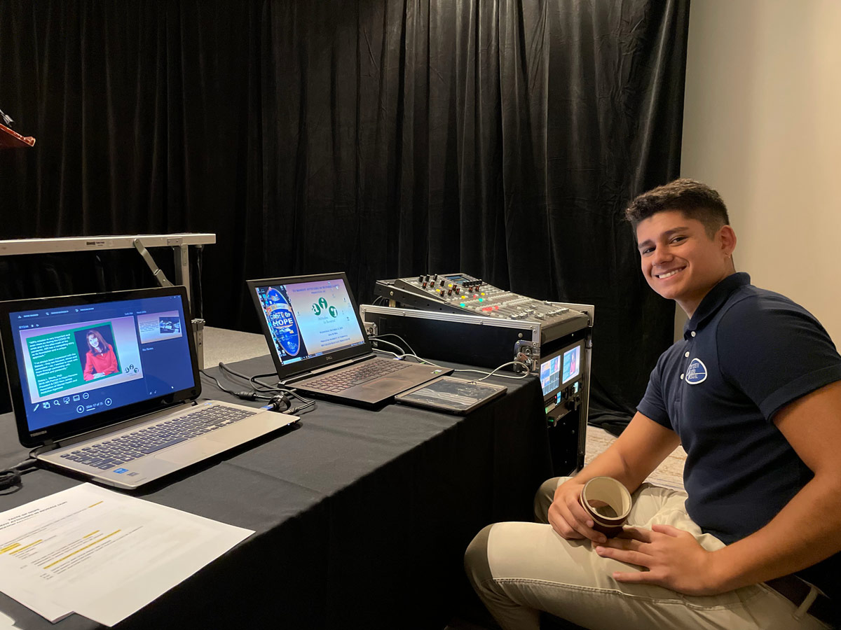 Bergen AV operator smiling at tech table during New Jersey corporate event